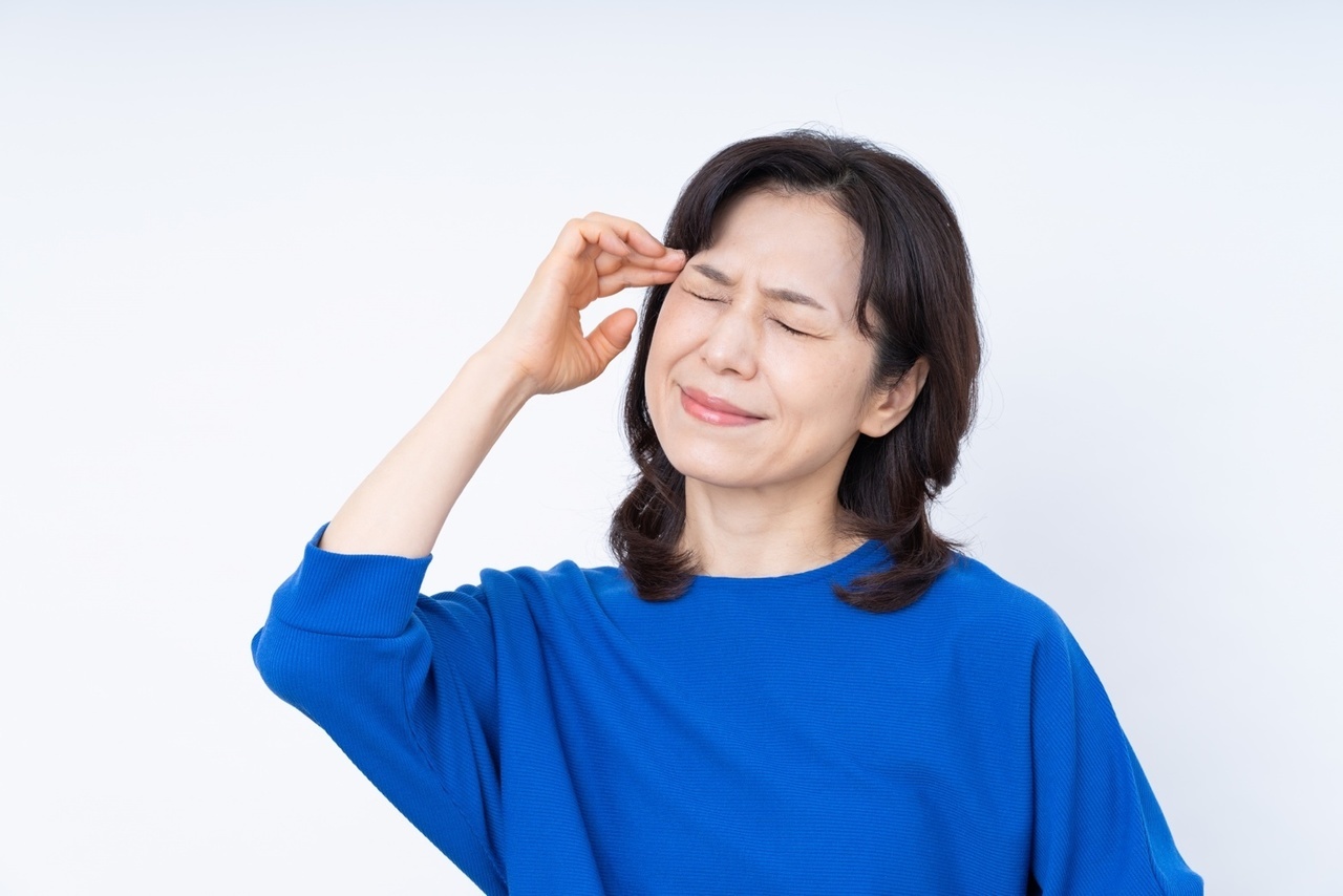頭の痛い女性の写真